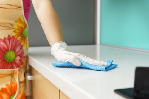 Cleaner in Hounslow preparing a safe cleaning service with protective equipment