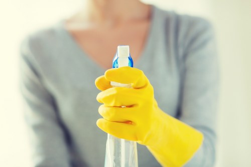Completed cleaning checklist beside eco-friendly waste disposal supplies