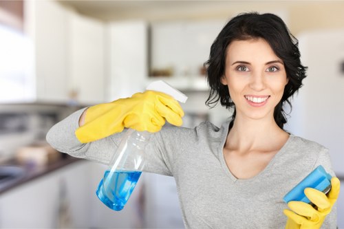 Cleaning staff following product safety and PPE rules