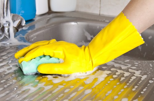 Trained cleaner in Hounslow using approved cleaning methods safely